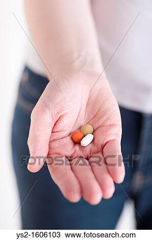 Hand showing three pills View Large Photo Image Stock Image - Hand showing three pills. Fotosearch