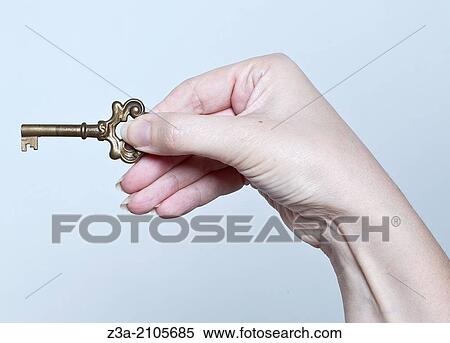 Stock Photography - Hand With Key, Hand Gesture, Studio shot. Fotosearch