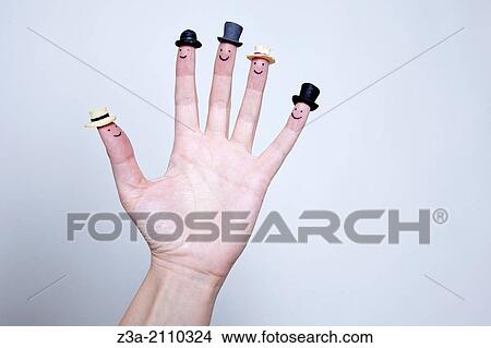 Hand With Smileys And Hats On Fingers, Hand Gesture, Studio shot View Large Photo Image Picture - Hand With Smileys And Hats On Fingers, Hand Gesture, Studio shot. Fotosearch