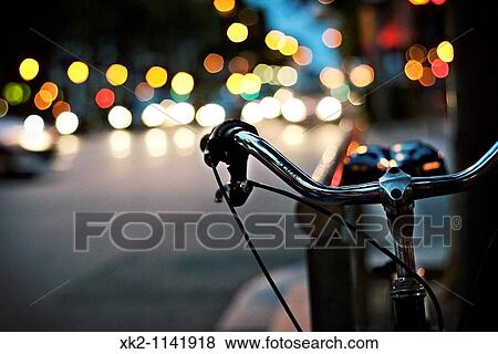 Handlebar of bike and lights in background, Barcelona, Catalonia, Spain View Large Photo Image Stock Photo - Handlebar of bike and lights in background, Barcelona, Catalonia, Spain. Fotosearch