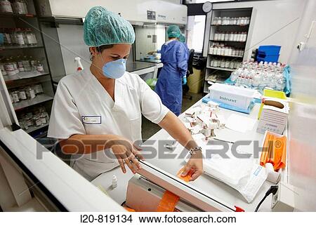 Handling cytostatic drug in safety hood, hospital pharmacy. Hospital Universitario de Gran Canaria Doctor Negrin, Las Palmas de Gran Canaria. Canary Islands, Spain View Large Photo Image Picture - Handling cytostatic drug in safety hood, hospital pharmacy. Hospital Universitario de Gran Canaria Doctor Negrin, Las Palmas de Gran Canaria. Canary Islands, Spain. Fotosearch