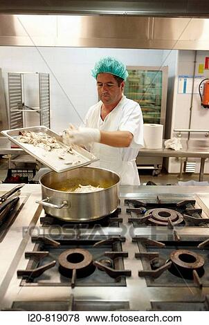 Handling food (chicken) in kitchen. Hospital Universitario de Gran Canaria Doctor Negrin, Las Palmas de Gran Canaria. Canary Islands, Spain View Large Photo Image Stock Photo - Handling food (chicken) in kitchen. Hospital Universitario de Gran Canaria Doctor Negrin, Las Palmas de Gran Canaria. Canary Islands, Spain. Fotosearch