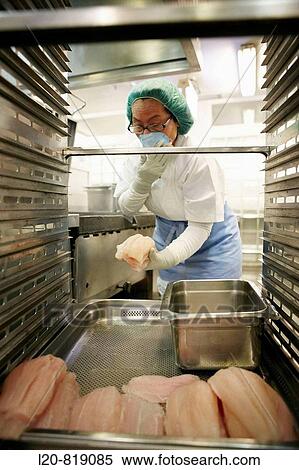 Handling food (fish) in kitchen. Hospital Universitario de Gran Canaria Doctor Negrin, Las Palmas de Gran Canaria. Canary Islands, Spain View Large Photo Image Stock Photography - Handling food (fish) in kitchen. Hospital Universitario de Gran Canaria Doctor Negrin, Las Palmas de Gran Canaria. Canary Islands, Spain. Fotosearch