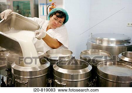 Stock Image - Handling food (milk) in kitchen. Hospital Universitario de Gran Canaria Doctor Negrin, Las Palmas de Gran Canaria. Canary Islands, Spain. Fotosearch