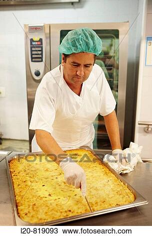 Handling food (omelet) in kitchen. Hospital Universitario de Gran Canaria Doctor Negrin, Las Palmas de Gran Canaria. Canary Islands, Spain View Large Photo Image Stock Image - Handling food (omelet) in kitchen. Hospital Universitario de Gran Canaria Doctor Negrin, Las Palmas de Gran Canaria. Canary Islands, Spain. Fotosearch