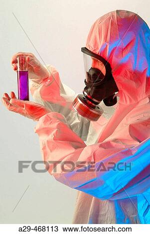 Stock Image - Handling toxic products.. Fotosearch