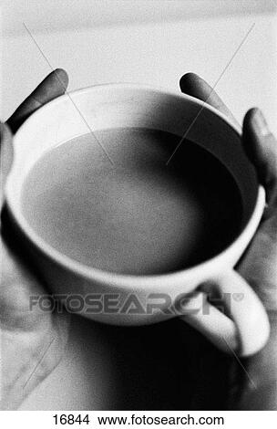 Hands holding a cup View Large Photo Image Picture - Hands holding a cup. Fotosearch