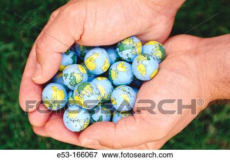 Hands holding? Earth balls? View Large Photo Image Stock Photo - Hands holding? Earth balls?. Fotosearch