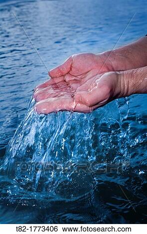 hands of a man collecting sea water, Tavira, Algarve, Portugal, Europe View Large Photo Image Stock Photograph - hands of a man collecting sea water, Tavira, Algarve, Portugal, Europe. Fotosearch