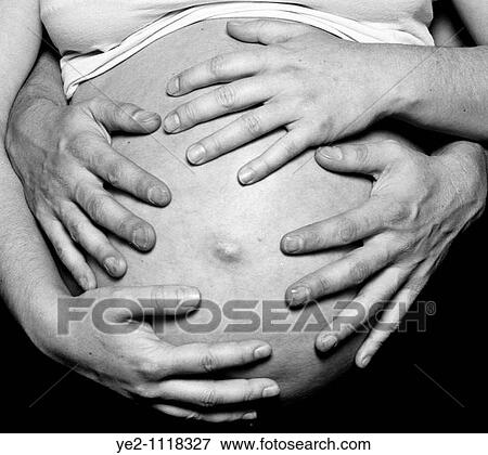 Hands on a pregnant woman View Large Photo Image Stock Photo - Hands on a pregnant woman. Fotosearch