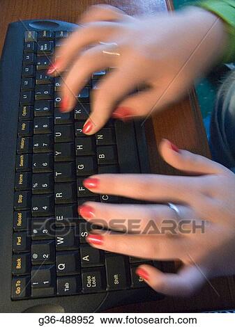 Stock Image - Hands on computer keyboard. Fotosearch