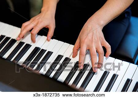Hands playing piano View Large Photo Image Stock Photography - Hands playing piano. Fotosearch
