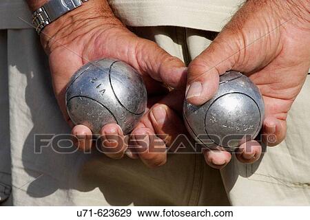 Hands with iron balls, Petanca game. Alicante. Comunidad Valenciana. Spain View Large Photo Image Stock Photo - Hands with iron balls, Petanca game. Alicante. Comunidad Valenciana. Spain. Fotosearch