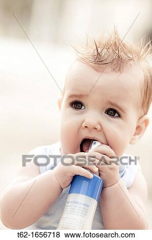 Handsome blonde babe playing all alone View Large Photo Image Stock Photo - Handsome blonde babe playing all alone. Fotosearch