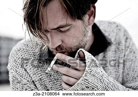 Picture - Handsome Man Smoking Cigarette. Fotosearch