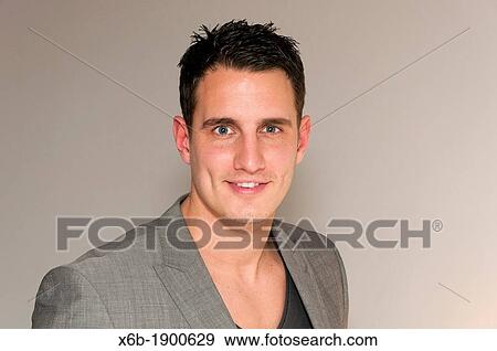 Handsome young man in smart casual clothing View Large Photo Image Stock Photo - Handsome young man in smart casual clothing. Fotosearch