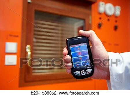 Handy: device management at home using an adapted interface for people with disabilities motion and hearing, integrated in a PDA View Large Photo Image Stock Image - Handy: device management at home using an adapted interface for people with disabilities motion and hearing, integrated in a PDA. Fotosearch