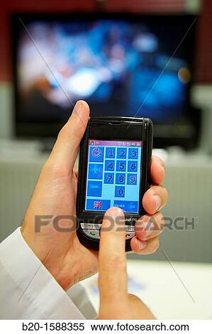 Handy: device management at home using an adapted interface for people with disabilities motion and hearing, integrated in a PDA View Large Photo Image Stock Photography - Handy: device management at home using an adapted interface for people with disabilities motion and hearing, integrated in a PDA. Fotosearch