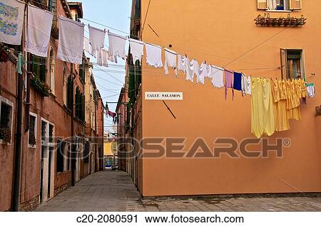 hanging lines of drying washing, across the street, Venice, Italy. View Large Photo Image Stock Image - hanging lines of drying washing, across the street, Venice, Italy.. Fotosearch