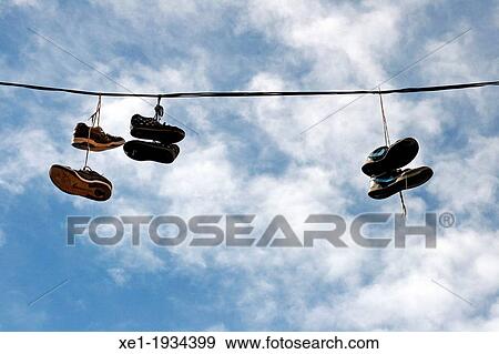 Stock Photo - Hanging shoes, Igualada, Catalonia, Spain. Fotosearch