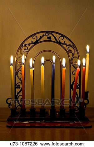 Hannukkia with 8 candles burning during the Jewish festival of Hanukkah. View Large Photo Image Stock Photograph - Hannukkia with 8 candles burning during the Jewish festival of Hanukkah.. Fotosearch