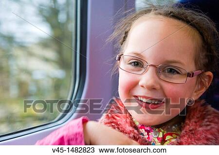 Happy 5 years old girl in the train View Large Photo Image Stock Image - Happy 5 years old girl in the train. Fotosearch