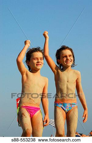 Stock Photo - Happy 6 year old girls on Bolonia beach, Tarifa. Cadiz province, Andalusia, Spain. Fotosearch