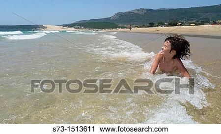 Happy 8 year old girls on Bolonia beach, Tarifa, CBdiz, Spain View Large Photo Image Stock Image - Happy 8 year old girls on Bolonia beach, Tarifa, CBdiz, Spain. Fotosearch