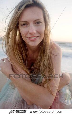 Happy blond sexy girl poses for the camera on a beach in California View Large Photo Image Stock Image - Happy blond sexy girl poses for the camera on a beach in California. Fotosearch