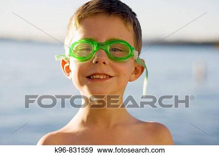 Happy boy about to swim wearing goggles View Large Photo Image Stock Photo - Happy boy about to swim wearing goggles. Fotosearch
