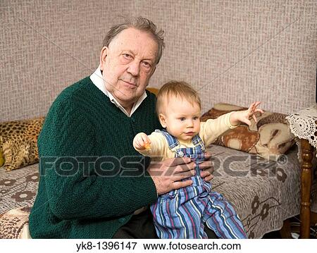 Stock Photo - Happy Caucasian Senior Grandfather Holding Kid Baby. Fotosearch