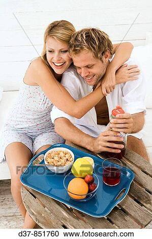 Happy couple at home having breakfast View Large Photo Image Stock Image - Happy couple at home having breakfast. Fotosearch