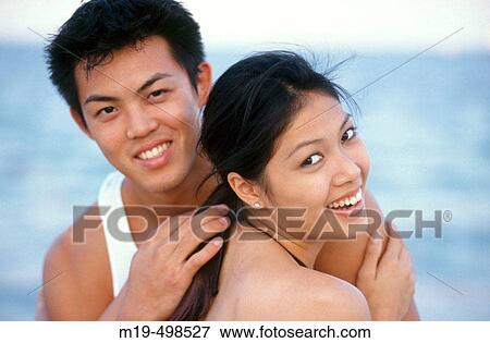 happy couple at the beach View Large Photo Image Stock Photo - happy couple at the beach. Fotosearch