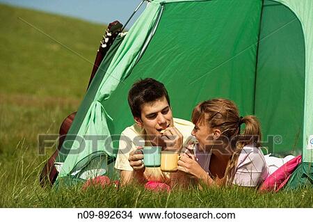 Picture - Happy Couple Camping. Fotosearch