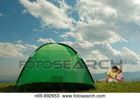 Stock Image - Happy Couple Camping. Fotosearch