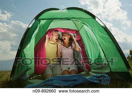 Stock Image - Happy Couple Camping. Fotosearch