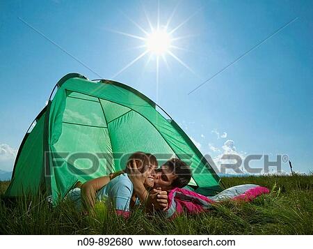 Stock Image - Happy Couple Camping. Fotosearch