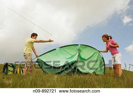 Stock Image - Happy Couple Camping. Fotosearch