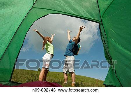 Stock Image - Happy Couple Camping. Fotosearch