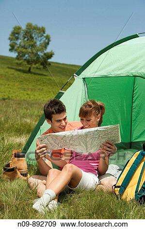Stock Photo - Happy Couple Camping. Fotosearch