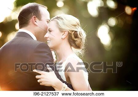happy couple embracing and enjoying a moment View Large Photo Image Stock Photo - happy couple embracing and enjoying a moment. Fotosearch