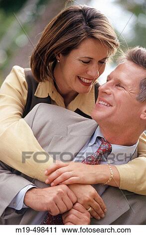 Stock Image - Happy couple embracing. Fotosearch