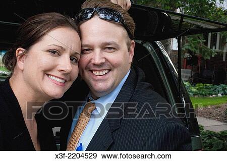 Happy couple enjoying a moment together in their neighborhood ages 41 and 39. St Paul Minnesota MN USA. View Large Photo Image Stock Photo - Happy couple enjoying a moment together in their neighborhood ages 41 and 39. St Paul Minnesota MN USA.. Fotosearch