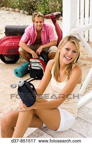 Happy couple having a break on a country trip View Large Photo Image Stock Photo - Happy couple having a break on a country trip. Fotosearch