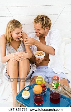 Happy couple having breakfast at home View Large Photo Image Stock Image - Happy couple having breakfast at home. Fotosearch