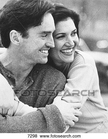 Happy couple hugging View Large Photo Image Stock Photo - Happy couple hugging. Fotosearch