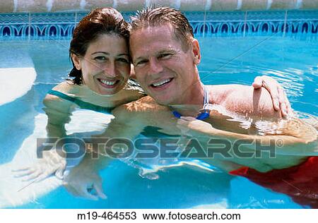 happy couple in a swiming pool View Large Photo Image Stock Image - happy couple in a swiming pool. Fotosearch