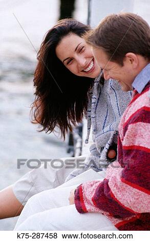 Happy couple laughing View Large Photo Image Stock Photo - Happy couple laughing. Fotosearch