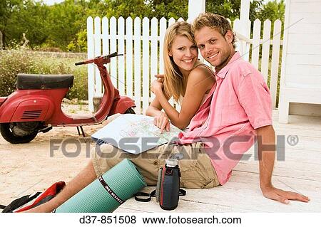 Stock Photo - Happy couple on a country trip. Fotosearch