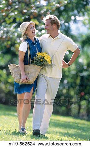 happy couple strolling outdoors View Large Photo Image Picture - happy couple strolling outdoors. Fotosearch